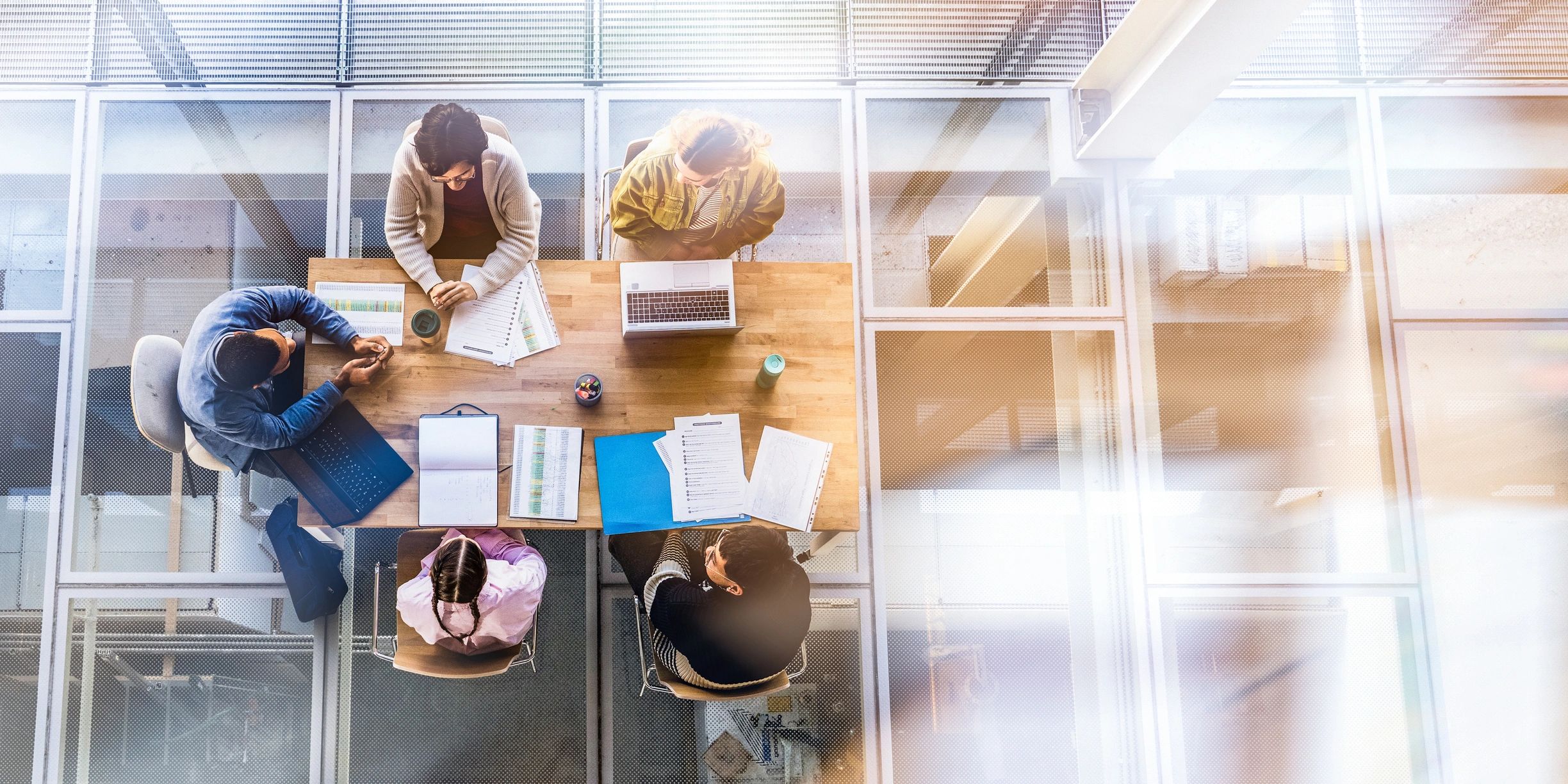 Aerial view of professionals collaborating in a modern office meeting